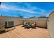 Rooftop deck with wooden floor, patio chairs and table at 4539 Tennyson St # 105, Denver, CO 80212