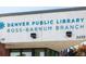 Denver Public Library Ross-Barnum Branch under blue awning, with text 'Denver Public Library Ross-Barnum Branch' at 3728 W 1St Ave, Denver, CO 80219
