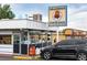 Exterior view of Grandpa's Burger Haven, #1 the big big bun, with a vintage-style sign, and a black car at 3728 W 1St Ave, Denver, CO 80219