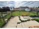Backyard featuring a patio, shed, and garden with a small bench, offering a blend of relaxation and practicality at 4312 S Xenon St, Morrison, CO 80465