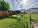 Large backyard featuring a shed, garden beds, and a privacy fence, perfect for outdoor enjoyment at 4312 S Xenon St, Morrison, CO 80465