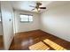 Bright bedroom with hardwood floors and a ceiling fan at 4312 S Xenon St, Morrison, CO 80465