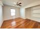 This bedroom features a hardwood floor, ceiling fan and a closet at 4312 S Xenon St, Morrison, CO 80465