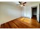 Sunlit bedroom featuring hardwood floors, neutral walls, and a ceiling fan at 4312 S Xenon St, Morrison, CO 80465