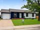 Charming single-story home with a well-manicured lawn and attached garage, presenting excellent curb appeal at 4312 S Xenon St, Morrison, CO 80465