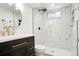 Bathroom featuring marble tile, gold hardware, and a modern walk-in shower at 9101 Clarkson St, Thornton, CO 80229