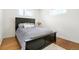 Well-lit bedroom featuring modern bed and a soft rug, creating a peaceful retreat at 9101 Clarkson St, Thornton, CO 80229