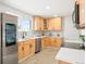 Bright kitchen with new appliances, quartz countertops, and ample natural light, creating an inviting space for cooking and gathering at 9101 Clarkson St, Thornton, CO 80229