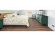 Charming bedroom with hardwood floors, natural light, and a comfy bed at 2250 N Monaco Pkwy, Denver, CO 80207