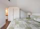 Cozy bedroom featuring hardwood floors, green accents, and natural light at 2250 N Monaco Pkwy, Denver, CO 80207