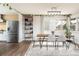 Bright dining room with a modern table, stylish chairs, natural light, and decor to enhance a comfortable eating experience at 2250 N Monaco Pkwy, Denver, CO 80207