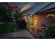 Inviting entrance featuring a brick facade and outdoor seating area with an ornate chair and flower pot at 2250 N Monaco Pkwy, Denver, CO 80207