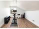 A home gym with hardwood floors and natural light provides an ideal workout space at 2250 N Monaco Pkwy, Denver, CO 80207