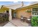 Cozy front porch featuring a decorative seating area, stone accents, and well-maintained landscaping at 2250 N Monaco Pkwy, Denver, CO 80207