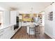 Bright kitchen with updated appliances, an island with bar seating, and plenty of counter space at 2250 N Monaco Pkwy, Denver, CO 80207