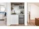 A convenient kitchenette offers a mini-fridge, sink, and microwave in a compact space at 2250 N Monaco Pkwy, Denver, CO 80207