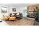 Cozy living room with fireplace, comfortable seating, and ample natural light at 2250 N Monaco Pkwy, Denver, CO 80207