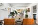Open-concept living space connecting sitting area, kitchen, and dining area at 2250 N Monaco Pkwy, Denver, CO 80207