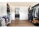 Spacious walk-in closet with well-organized shelves and hanging space at 2250 N Monaco Pkwy, Denver, CO 80207