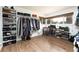 Walk-in closet with built in shoe racks and plenty of space for storage at 2250 N Monaco Pkwy, Denver, CO 80207