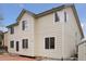 Back exterior of home with siding, steps to yard, and brick patio at 20481 E Mansfield Pl, Aurora, CO 80013