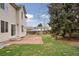 Back yard with grass and brick patio, perfect for outdoor entertaining at 20481 E Mansfield Pl, Aurora, CO 80013