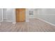 Finished basement area with laminate flooring, neutral walls, closet and natural light at 20481 E Mansfield Pl, Aurora, CO 80013