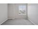 Bedroom featuring neutral walls, gray carpet, and a window with blinds at 20481 E Mansfield Pl, Aurora, CO 80013