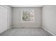 Bedroom featuring a window with blinds, neutral walls and carpet, and a double closet at 20481 E Mansfield Pl, Aurora, CO 80013