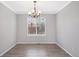 Open dining area features modern light fixture and lots of natural light at 20481 E Mansfield Pl, Aurora, CO 80013