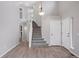 Bright entryway with high ceilings, staircase, and modern flooring at 20481 E Mansfield Pl, Aurora, CO 80013
