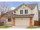 Charming two-story home features a two-car garage and well-maintained landscaping at 20481 E Mansfield Pl, Aurora, CO 80013