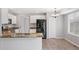 Bright kitchen features white cabinets, stainless steel appliances, and granite countertops at 20481 E Mansfield Pl, Aurora, CO 80013