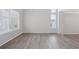 Spacious living room boasts lots of natural light and modern flooring at 20481 E Mansfield Pl, Aurora, CO 80013