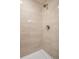 Modern shower with large format neutral tile, sleek fixtures, and white shower base at 20481 E Mansfield Pl, Aurora, CO 80013