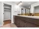 Elegant bathroom featuring double sinks, modern fixtures, and a glass-enclosed shower at 14265 Currant St, Broomfield, CO 80020