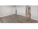 Empty room featuring wood floor and closet with access to a second room at 14265 Currant St, Broomfield, CO 80020
