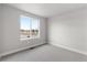 Empty bedroom with large window overlooking a nice landscape, with neutral carpet at 14265 Currant St, Broomfield, CO 80020