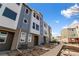 Exterior view of modern townhomes with stylish blue and white accents at 14265 Currant St, Broomfield, CO 80020