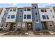 Attractive townhome with a brick facade and blue and white siding at 14265 Currant St, Broomfield, CO 80020