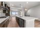 Bright kitchen featuring a large island with seating and stainless steel appliances at 14265 Currant St, Broomfield, CO 80020