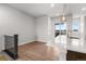 Living room with a view to the back deck and stylish pendant lighting at 14265 Currant St, Broomfield, CO 80020