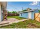 View of the backyard featuring a small lawn and storage building at 5001 W Nevada Pl, Denver, CO 80219