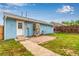Cozy backyard with a small brick patio and lawn at 5001 W Nevada Pl, Denver, CO 80219
