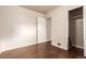 Spacious bedroom with hardwood floors and an open closet at 5001 W Nevada Pl, Denver, CO 80219