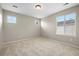 Neutral bedroom featuring two windows, neutral walls, neutral carpet, and bright natural light at 12942 Leyden St, Thornton, CO 80602