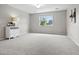 A bright, roomy bedroom has neutral walls and carpet. Accented by a fish tank, it's ideal for restful nights at 12942 Leyden St, Thornton, CO 80602