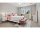 Charming bedroom with a plush rug and a bench, complemented by a window view and a cozy ambiance at 12942 Leyden St, Thornton, CO 80602