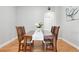 Cozy dining room featuring hardwood floors and a classic dining set at 12942 Leyden St, Thornton, CO 80602