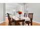 Elegant dining room with hardwood floors, natural light, and stylish furnishings at 12942 Leyden St, Thornton, CO 80602